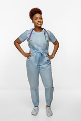 Image showing Beautiful african-american doctor or nurse smiling isolated over white studio background