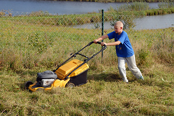 Image showing mowing grass