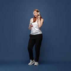 Image showing Young caucasian woman in casual wear. Bodypositive female character, plus size businesswoman