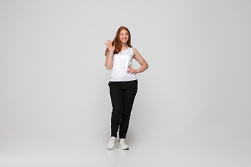 Image showing Young caucasian woman in casual wear. Bodypositive female character, plus size businesswoman