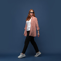 Image showing Young caucasian woman in casual wear. Bodypositive female character, plus size businesswoman