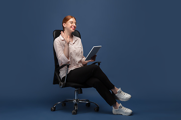 Image showing Young caucasian woman in casual wear. Bodypositive female character, plus size businesswoman