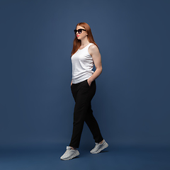 Image showing Young caucasian woman in casual wear. Bodypositive female character, plus size businesswoman