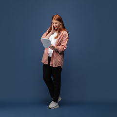 Image showing Young caucasian woman in casual wear. Bodypositive female character, plus size businesswoman