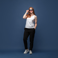 Image showing Young caucasian woman in casual wear. Bodypositive female character, plus size businesswoman