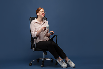 Image showing Young caucasian woman in casual wear. Bodypositive female character, plus size businesswoman