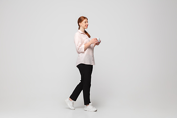 Image showing Young caucasian woman in casual wear. Bodypositive female character, plus size businesswoman