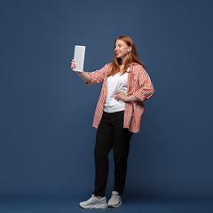 Image showing Young caucasian woman in casual wear. Bodypositive female character, plus size businesswoman