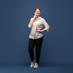 Image showing Young caucasian woman in casual wear. Bodypositive female character, plus size businesswoman