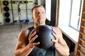 Image showing young man with medicine ball in gym