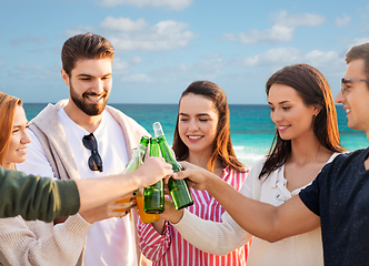 Image showing friends toasting non alcoholic drinks on beach