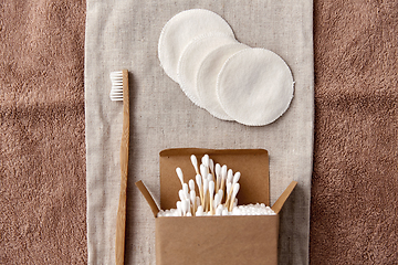 Image showing wooden toothbrush, cotton pads and swabs in box