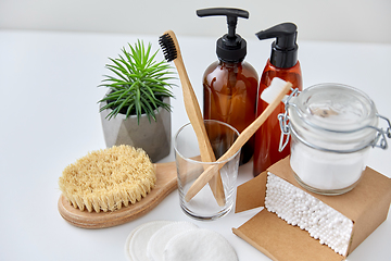 Image showing wooden toothbrush, cotton pads and swabs in box