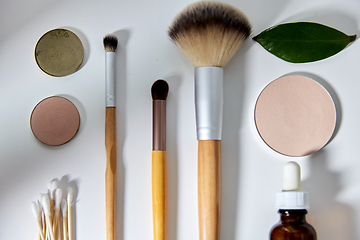 Image showing make up brushes, cosmetics and cotton swabs