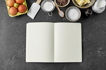 Image showing recipe book and cooking ingredients on table