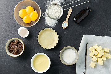 Image showing baking dish with dough and cooking ingredients