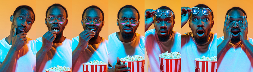 Image showing Portrait of african-american man on orange background in neon light, creative collage