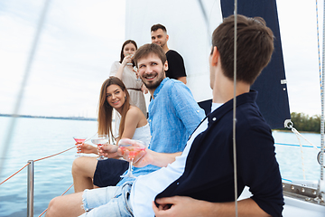 Image showing Group of happy friends drinking vodka cocktails at boat party outdoor, cheerful and happy