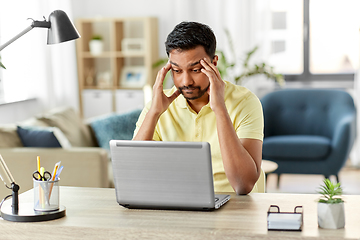 Image showing indian man with laptop working at home office