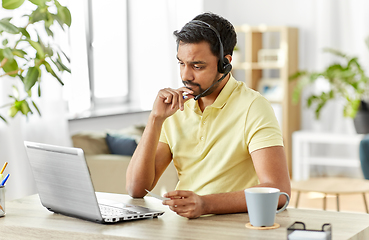 Image showing indian man with headset and laptop working at home