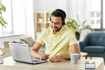 Image showing indian man with headset and laptop working at home