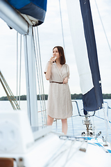 Image showing Happy smiling woman drinking vodka cocktails at boat party outdoor, cheerful and happy