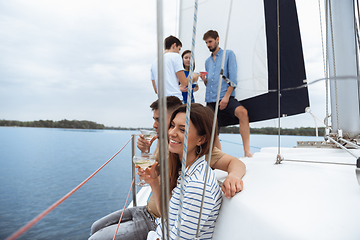 Image showing Group of happy friends drinking vodka cocktails at boat party outdoor, cheerful and happy