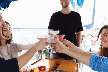 Image showing Group of happy friends drinking vodka cocktails at boat party outdoor, cheerful and happy