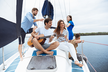 Image showing Group of happy friends drinking vodka cocktails at boat party outdoor, cheerful and happy