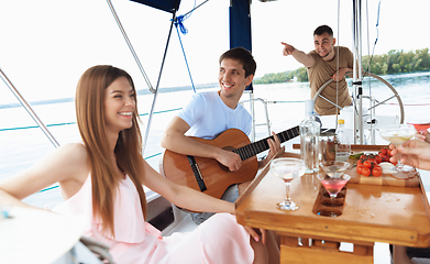 Image showing Group of happy friends drinking vodka cocktails at boat party outdoor, cheerful and happy