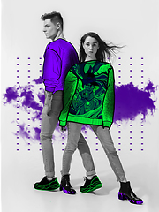 Image showing Casual young stylish couple on white background with colourful art drawings in comics style