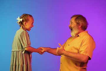 Image showing Senior man, grandfather having fun and spending time together with girl, granddaughter. Joyful elderly lifestyle concept