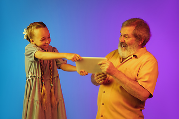 Image showing Senior man, grandfather having fun and spending time together with girl, granddaughter. Joyful elderly lifestyle concept