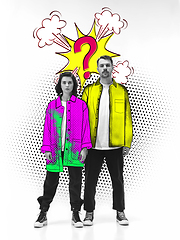 Image showing Casual young stylish couple on white background with colourful art drawings in comics style