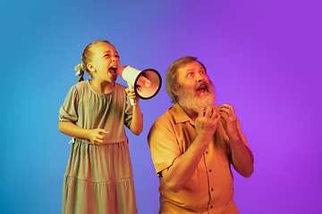 Image showing Senior man, grandfather having fun and spending time together with girl, granddaughter. Joyful elderly lifestyle concept