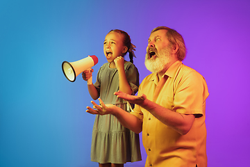 Image showing Senior man, grandfather having fun and spending time together with girl, granddaughter. Joyful elderly lifestyle concept