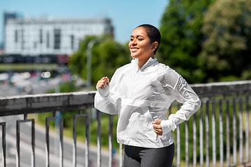 Image showing african american woman running outdoors