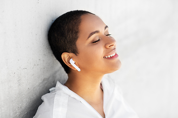 Image showing happy african american woman with earphones