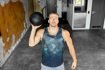 Image showing young man with medicine ball in gym