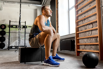 Image showing young man with medicine ball in gym