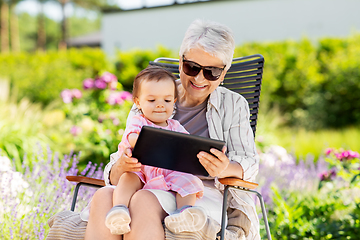 Image showing grandmother and baby granddaughter with tablet pc