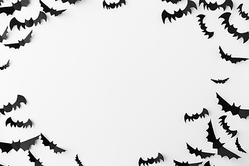 Image showing flock of black paper bats over white background