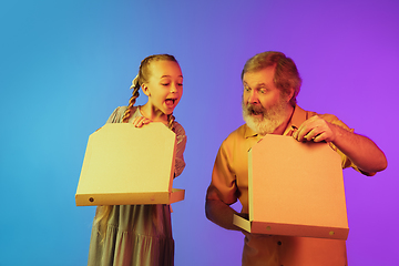 Image showing Senior man, grandfather having fun and spending time together with girl, granddaughter. Joyful elderly lifestyle concept