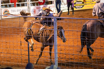 Image showing cowboy rodeo championship in the evening