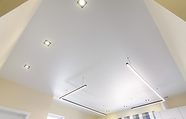 Image showing Modern white matte stretch ceiling with zoned lighting
