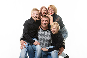 Image showing Children and mom hug happy dad, portrait of large adult family, isolated on white background