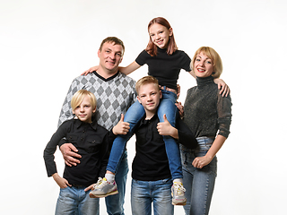 Image showing Half-length portrait of an ordinary Russian family in casual clothes on a white background