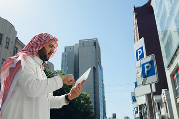 Image showing Smiling rich arabian man\'s buying real estate in the city