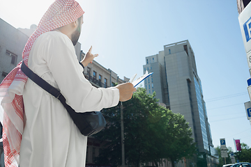 Image showing Smiling rich arabian man\'s buying real estate in the city