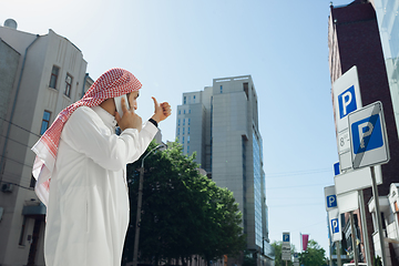 Image showing Smiling rich arabian man\'s buying real estate in the city